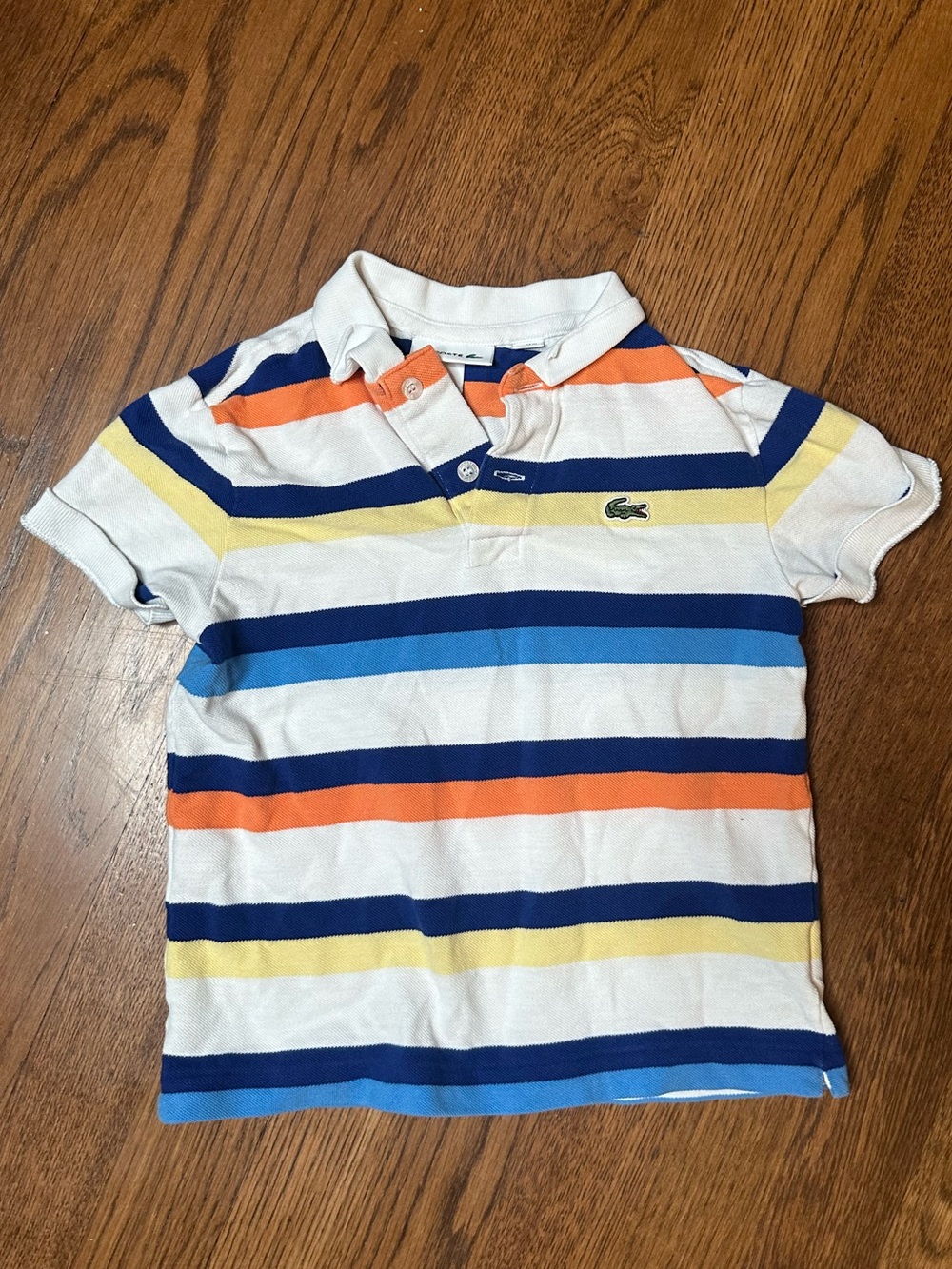 Lacoste Kids Striped Polo in White with Blue, Orange & Yellow